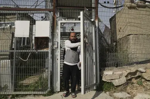 Hamdan Ballal, Oscar-winning Palestinian director of "No Other Land," is released from a police station in the West Bank settlement of Kiryat Arba a day after being detained by the Israeli army following an attack by Jewish settlers, Tuesday, March 25, 2025. (AP Photo/Leo Correa)