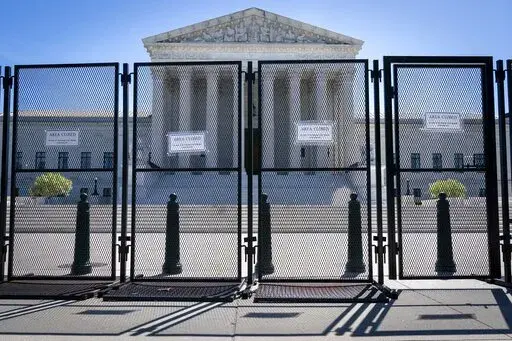 Anti-scaling fencing blocks off the Supreme Court, May 10, 2022, in Washington. (AP Photo/Jacquelyn Martin, File)