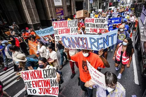 Housing activists march across town toward New York Gov. Kathy Hochul's office, calling for an extension of pandemic-era eviction protections, Tuesday, Aug. 31, 2021, in New York. Prices paid by U.S. consumers jumped in December 2021 compared to a year earlier, the latest evidence that rising costs for food, gas, rent and other necessities are heightening the financial pressures on America's households. (AP Photo/Mary Altaffer, File)