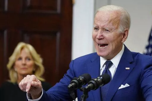 President Joe Biden speaks about the mass shooting at Robb Elementary School in Uvalde, Texas, from the White House, in Washington, Tuesday, May 24, 2022, as first lady Jill Biden listens. (AP Photo/Manuel Balce Ceneta)
