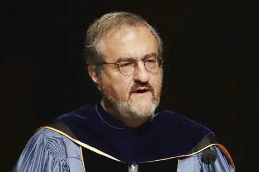 In this Jan. 30 2017, file photo, University of Michigan President Mark Schlissel speaks during a ceremony at the university, in Ann Arbor, Mich. Schlissel has been removed as president of the University of Michigan due to the alleged "inappropriate relationship with a University employee," the school said Saturday, Jan. 15, 2022, on its website. (AP Photo/Carlos Osorio, File)