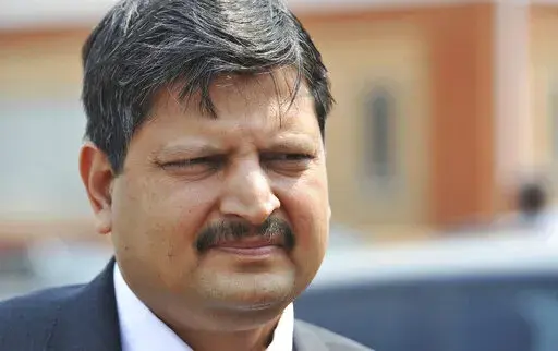 Atul Gupta, of the Gupta family, is seen outside magistrates courts in Johannesburg, Sept. 2010. Dubai police said Tuesday, June 7, 2022, that they have arrested two brothers, Atul and Rajesh from the Gupta family wanted in connection with a corruption case involving former South African President Jacob Zuma, the latest high-profile extradition case involving the United Arab Emirates. (AP Photo)