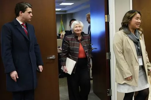 U.S. Treasury Secretary Janet Yellen tours the work area during a visit to the Financial Crimes Enforcement Network (FinCEN) in Vienna, Va., Monday, Jan. 8, 2024. Yellen announced that 100,000 businesses have joined a new database that collects "beneficial ownership" information on firms as part of a new government effort to unmask shell company owners. (AP Photo/Susan Walsh)
