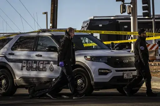 Police respond to a deadly shooting at Kirtland Air Force Base in Albuquerque, N.M., early Saturday, Feb. 22, 2025. (Chancey Bush/The Albuquerque Journal via AP)