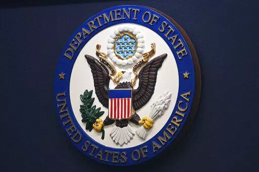 The State Department seal is seen on the briefing room lectern at the State Department in Washington, Jan. 31, 2022. Everyday Americans will be able to help refugees adjust to life in the U.S. in a program being launched by the State Department. The goal is to give private citizens a role in resettling the thousands of refugees who come to America every year. The State Department is calling the new program the Welcome Corps.(Mandel Ngan, Pool via AP, File)