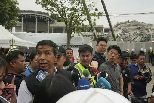 Bangkok Gov. Chadchart Sittipunt talks to the media at the site of an under-construction high-rise building that collapsed after an earthquake in Bangkok, Thailand, Monday, March, 31, 2025. (AP Photo/Manish Swarup)