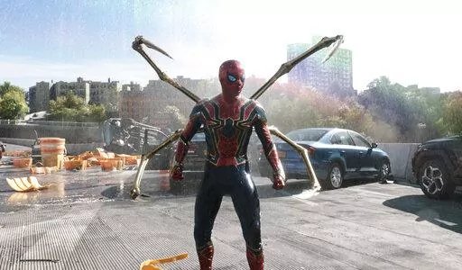 This image released by Sony Pictures shows Tom Holland in Columbia Pictures' "Spider-Man: No Way Home." Sony’s superhero juggernaut swung back to first place in its sixth weekend in theaters and became the sixth highest grossing film of all time, globally. The film topped the North American charts with $14.1 million, according to studio estimates on Sunday. Globally, it’s now grossed nearly $1.7 billion, passing the total earnings of both “Jurassic World” and “The Lion King.” (Sony P
