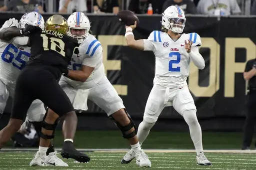 Mississippi quarterback Jaxson Dart (2) looks to pass against Wake Forest during the first half of an NCAA college football game in Winston-Salem, N.C., Saturday, Sept. 14, 2024. (AP Photo/Chuck Burton)