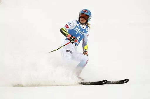 United States' Mikaela Shiffrin checks her time at the finish area of an alpine ski, women's World Cup giant slalom, in Kronplatz, Italy, Jan. 25, 2022. Empathizing with other athletes’ frank conversations about mental health got Shiffrin thinking about what awaits her at the Beijing Olympics. (AP Photo/Gabriele Facciotti, File)
