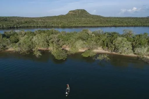 Fishermen work in the Tapajos River in Alter do Chao, district of Santarem, Para state, Brazil, Aug. 27, 2020. (AP Photo/Andre Penner, File)