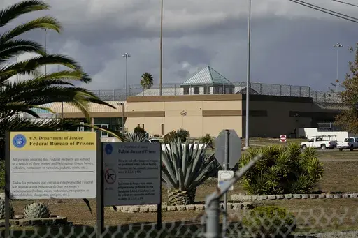 The Federal Correctional Institution stands in Dublin, Calif., on Dec. 5, 2022. Federal investigators on Monday, March 11, 2024, are again searching the troubled women's prison, seizing computers and documents in an apparent escalation of a yearslong sexual abuse investigation that led to previous charges against a former warden and other employees. (AP Photo/Jeff Chiu, File)