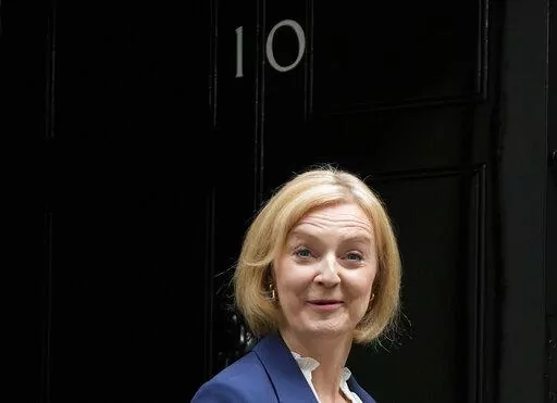 British Prime Minister Liz Truss leaves 10 Downing Street to attend her first Prime Minister's Questions at the Houses of Parliament, in London, Wednesday, Sept. 7, 2022. (AP Photo/Frank Augstein)