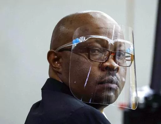 Accused serial killer Billy Chemirmir looks back during his retrial on April 25, 2022, at Frank Crowley Courts Building in Dallas. A man who has been charged with killing 22 women in the Dallas area is set to go on trial in the death of an 87-year-old woman. Billy Chemirmir's capital murder trial in the death of Mary Brooks is scheduled to begin Monday, Oct. 3, 2022, in Dallas. (Shafkat Anowar/The Dallas Morning News via AP, Pool, File)