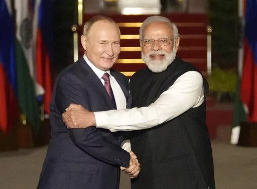 Russian President Vladimir Putin, left, and Indian Prime Minister Narendra Modi greet each other before their meeting in New Delhi, India on Dec. 6, 2021. India is bracing for a disruption in Russian arms supplies following Moscow's invasion of Ukraine, and Prime Minister Narendra Modi's tightrope walk between Moscow and Washington could become more difficult due to a border standoff with China. (AP Photo/Manish Swarup, File)