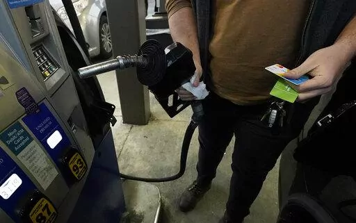 A customer prepares to pump gasoline into his car at a Sam's Club fuel island in Gulfport, Miss., Feb. 19, 2022. The Russia-Ukraine crisis is helping to raise oil and gasoline prices to high levels. Gasoline prices are setting a new record, and they're likely to go higher in the coming weeks. The national average topped $4.17 a gallon on Tuesday, March 8 according to auto club AAA. Californians already pay over $5 on average, and residents in a few other states could soon join them.  (AP Photo/R
