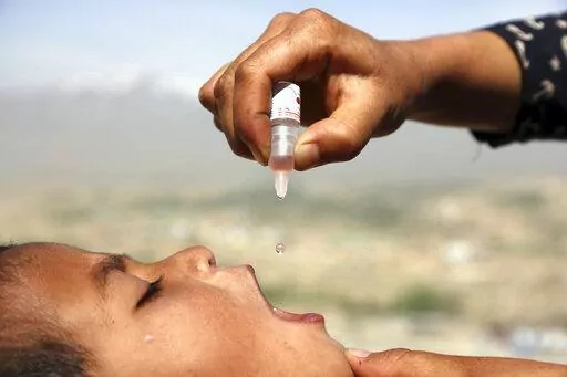 An Afghan health worker uses an oral polio vaccine on a child as part of a campaign to eliminate polio, on the outskirts of Kabul, Afghanistan, April 18, 2017. For years, global health officials have used billions of drops of an oral vaccine in a remarkably effective campaign aimed at wiping out polio in its last remaining strongholds — typically, poor, politically unstable corners of the world. Now, in a surprising twist in the decades-long effort to eradicate the virus, authorities in Jerusa