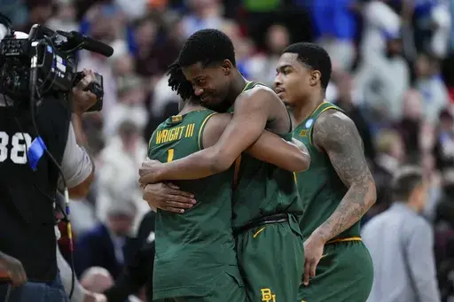 Baylor guard VJ Edgecombe, center, celebrates with guard Robert Wright III (1) after their team's victory over Mississippi State in the first round of the NCAA college basketball tournament, Friday, March 21, 2025, in Raleigh, N.C. (AP Photo/Stephanie Scarbrough)