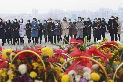 North Koreans visit and pay respect to the statues of late leaders Kim Il Sung and Kim Jong Il on Mansu Hill in Pyongyang, North Korea, on, Jan. 22, 2023, on the occasion of the Lunar New Year. Russia’s embassy in North Korea says the country has eased stringent epidemic controls in capital Pyongyang that were placed during the past five days to slow the spread of respiratory illnesses. (AP Photo/Cha Song Ho, File)