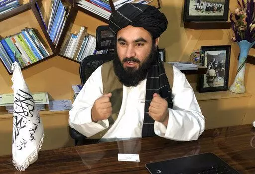 Education Ministry spokesman Mawlvi Aziz Ahmad Rayan speaks during an interview with The Associated Press in Kabul, Afghanistan, Wednesday, March 23, 2022. Afghanistan's Taliban rulers unexpectedly decided against reopening schools Wednesday to girls above the sixth grade, reneging on a promise and opting to appease their hard-line base at the expense of further alienating the international community. (AP Photo/Mohammed Shoaib Amin)