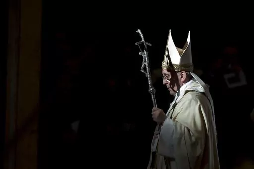 Pope Francis holds the pastoral staff as he leaves after celebrating a Mass in St. Peter's Basilica, at the Vatican, to mark Epiphany, Jan. 6, 2014. Pope Francis celebrates the 10th anniversary of his election Monday, March 13, 2023, far outpacing the "two or three" years he once envisioned for his papacy and showing no signs of slowing down. (AP Photo/Andrew Medichini, File)