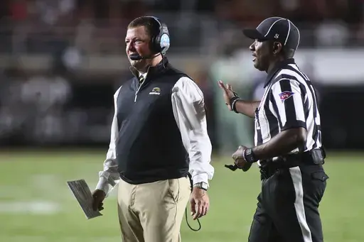 Southern Mississippi head coach Will Hall, left, walks back to the sideline after arguing with a referee in the first quarter of an NCAA college football game against Florida State Saturday, Sept. 9, 2023, in Tallahassee, Fla. (AP Photo/Phil Sears, File)