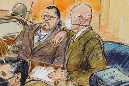 This artist sketch depicts Guy Wesley Reffitt, joined by his lawyer William Welch, right, in Federal Court, in Washington, on Feb. 28, 2022. Reffitt was convicted on Tuesday, March 8, of storming the U.S. Capitol with a holstered handgun. It's a milestone victory for federal prosecutors in the first trial among hundreds of cases arising from last year’s riot. (Dana Verkouteren via AP)