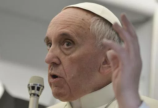 In this July 29, 2013 file photo, Pope Francis answers reporters questions during a news conference aboard the papal flight of his famous quip "Who am I to judge?", on the journey back from Brazil. Francis' apology Tuesday, May 28, 2024, for using a vulgar term to refer to gay men was the latest comment to make headlines about the Catholic Church's teachings on homosexuality. Francis has made a hallmark of reaching out to LGBTQ+ Catholics, but his 11-year pontificate has also seen plenty of prob