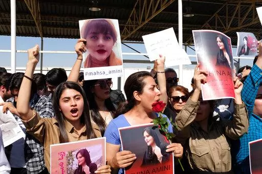 Protesters gather outside the UN headquarters in Erbil on Sept. 24, 2022, to protest the death of Masha Amini, who had fallen into a coma for three days after being detained by the morality police in Tehran, Iran.  Spontaneous mass gatherings to persistent scattered demonstrations have unfolded in Iran, as nationwide protests over the death of a young woman in the custody of the morality police enter their fourth week. (AP Photo/Hawre Khalid, Metrography, File)