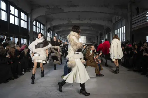 Models wear creations as part of the Sacai Fall/Winter 2025-2026 Womenswear collection presented in Paris, Monday, March 10, 2025. (Photo by Scott A Garfitt/Invision/AP)