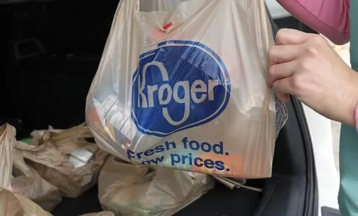 A customer removes her purchases at a Kroger grocery store in Flowood, Miss., Wednesday, June 26, 2019. Don't count on a favorite store being open on Easter Sunday. Several stores will be closed March 31, 2024, in observance of the holiday. (AP Photo/Rogelio V. Solis, File)
