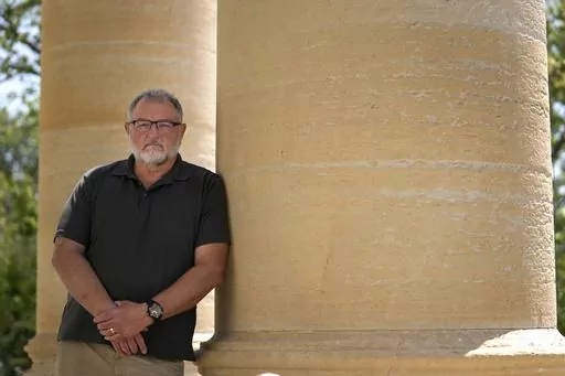 Macoupin County Republican Central Committee Chairman Tom Stoecker poses for a photo outside the Macoupin County Courthouse Tuesday, May 23, 2023, in Carlinville, Ill. Carlinville is located in one of Illinois' Congressional districts that flipped from Republican to Democrat as a result of gerrymandering. (AP Photo/Jeff Roberson)