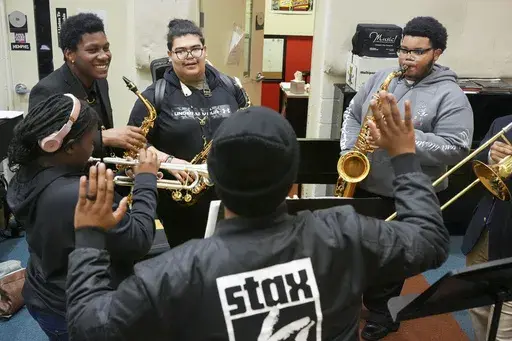 Casey Brunson, Casey Brunson, Steevan Galindo and Joseph Moore, from left, take direction from Christopher Franklin, center, during a rehearsal at the Stax Music Academy, Thursday, Jan. 30, 2025, in Memphis, Tenn. (AP Photo/George Walker IV)