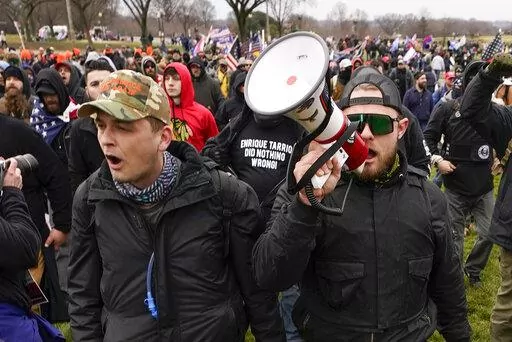 Proud Boys members Zachary Rehl, left, and Ethan Nordean, left, walk toward the U.S. Capitol in Washington, in support of President Donald Trump, Jan. 6, 2021. An upcoming hearing of the U.S. House Committee probing the Jan. 6 insurrection is expected to examine ties between people in former President Donald Trump's orbit and extremist groups who played a role in the Capitol riot. (AP Photo/Carolyn Kaster, File)