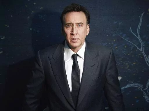 Nicolas Cage poses for a portrait to promote "The Unbearable Weight of Massive Talent" in New York on April 9, 2022. (Photo by Taylor Jewell/Invision/AP)