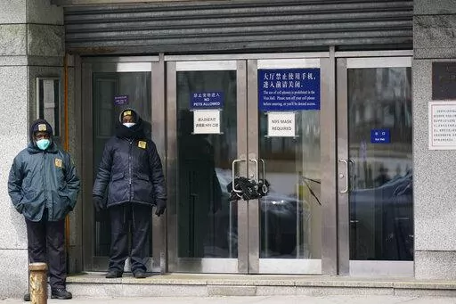 Guards stand outside of the Chinese consulate in New York, on March 28, 2022. Some of China's state media reporters are identifying as travel bloggers and lifestyle influencers on U.S.-owned social media platforms such as Instagram, Facebook and YouTube, racking up millions of followers from around the globe. The Associated Press has identified dozens of these accounts, which are part of a network of profiles that allow China to easily peddle propaganda to unsuspecting social media users.  (AP P