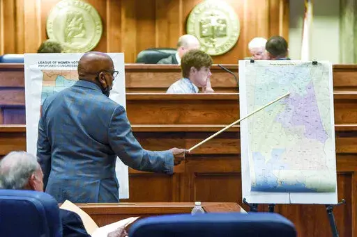 Sen. Rodger Smitherman compares U.S. Representative district maps during the special session on redistricting at the Alabama Statehouse in Montgomery, Ala., on Nov. 3, 2021. The Supreme Court has put on hold a lower court ruling that Alabama must draw new congressional districts before the 2022 elections, boosting Republican chances to hold six of the state’s seven seats in the House of Representatives.  (Mickey Welsh/The Montgomery Advertiser via AP, File)