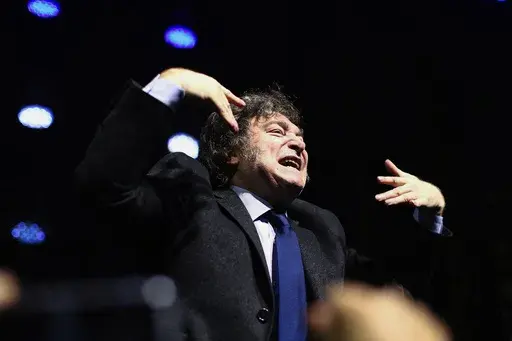 Argentina's President Javier Milei gestures to the audience after giving a speech at CPAC Brasil 2024, a conservative event, in Balneario Camboriu, Santa Catarina state, Brazil, Sunday, July 7, 2024. (AP Photo/Heuler Andrey)