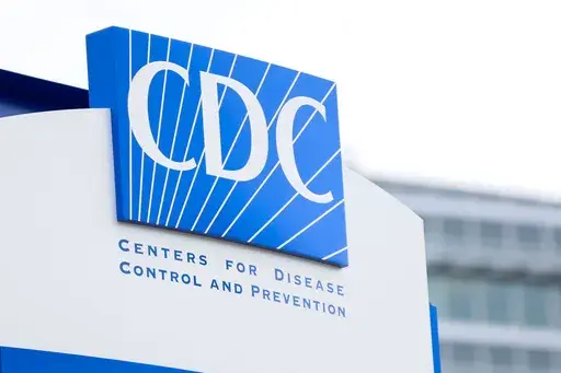 A sign with the CDC logo is displayed at the entrance to the agency's headquarters in Atlanta, on Sunday, March 2, 2025. (Miguel Martinez/Atlanta Journal-Constitution via AP)