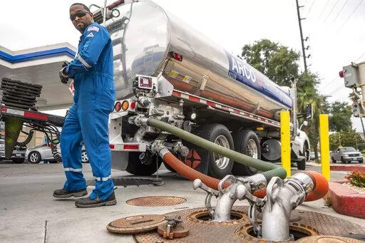A driver delivers 8,500 gallons of gasoline at an ARCO gas station in Riverside, Calif., Saturday, May 28, 2022. (AP Photo/Damian Dovarganes, File)