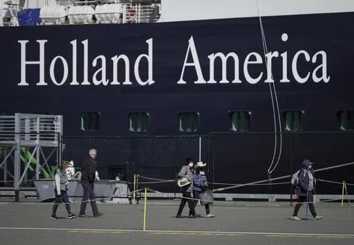A Holland America cruise ship is shown in Victoria, Canada on Saturday, April 9, 2022. Two crew members on a Holland America cruise ship died during an “incident” in the ship's engineering space, the cruise line said. The unidentified crew members died Friday, March 22, 2024, while the Florida-based Nieuw Amsterdam was at Half Moon Cay in the Bahamas, Holland America said in a statement.(Darryl Dyck/The Canadian Press via AP)