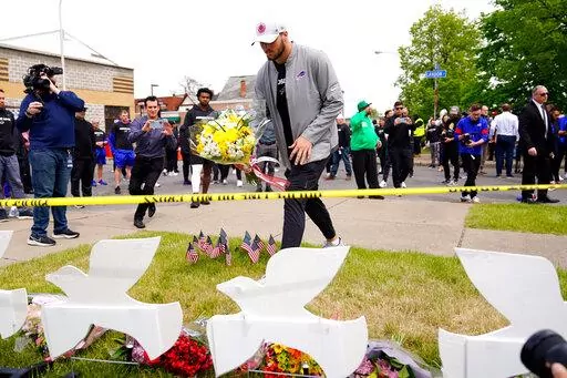 Buffalo Bills' Josh Allen visits the scene of Saturday's shooting at a supermarket, in Buffalo, N.Y., Wednesday, May 18, 2022. (AP Photo/Matt Rourke)