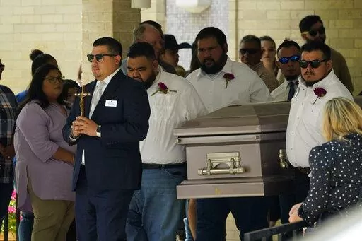 Pallbearers carry the casket of Amerie Jo Garza following funeral services at Sacred Heart Catholic Church, Tuesday, May 31, 2022, in Uvalde, Texas. Garza was killed in last week's elementary school shooting, (AP Photo/Eric Gay)