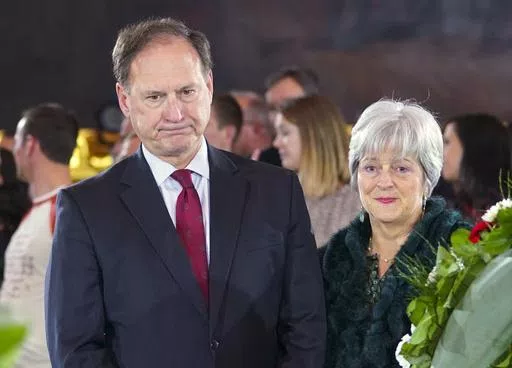 Supreme Court Justice Samuel Alito Jr., left, and his wife Martha-Ann Alito, pay their respects at the casket of Reverend Billy Graham at the Rotunda of the U.S. Capitol Building in Washington, Feb. 28, 2018. Alito rejects calls to step aside from Supreme Court cases on Trump and Jan. 6. (AP Photo/Pablo Martinez Monsivais, File)