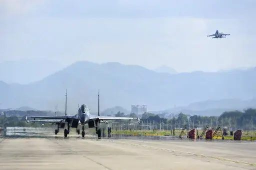 In this photo released by China's Xinhua News Agency, air force and naval aviation corps of the Eastern Theater Command of the Chinese People's Liberation Army (PLA) fly planes at an unspecified location in China, Aug. 4, 2022. The Chinese air force is sending fighter jets and bombers to Thailand for a joint exercise with the Thai military on Sunday, Aug. 14, 2022. (Fu Gan/Xinhua via AP, File)