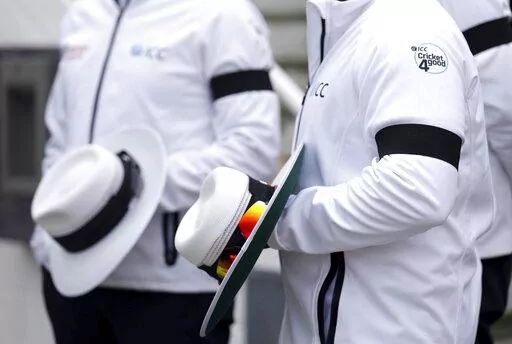 Umpires wearing black armbands on day three of the third LV= Insurance Test match at the Kia Oval, following the death of Queen Elizabeth II, Saturday September 10, 2022.  (John Walton/PA via AP)