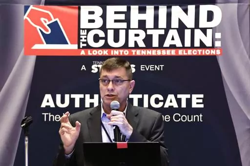 Clay Parikn talks about variables in security during an Election Conspiracy Forum Saturday, March 11, 2023, in Franklin, Tenn. (AP Photo/Wade Payne)