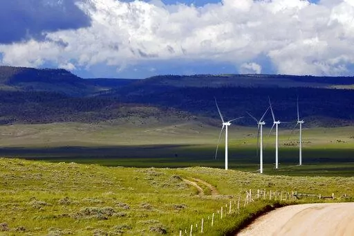 Clouds cast shadows near wind turbines at a wind farm along the Montana-Wyoming state line on June 13, 2022. The Biden administration is proposing a new permitting program for wind energy turbines, power lines and other projects that kill bald and golden eagles. (AP Photo/Emma H. Tobin, File)