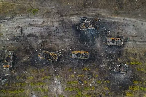 Destroyed Russian armored vehicles sit on the outskirts of Kyiv, Ukraine, March 31, 2022. Disinformation about Russia's invasion of Ukraine is surging in Spanish, as content crafted for a Latin American audience gets a boost from the Kremlin. (AP Photo/Rodrigo Abd, File)