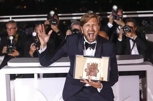 Writer/director Ruben Ostlund, winner of the Palme d'Or for 'Triangle of Sadness,' poses for photographers during the photo call following the awards ceremony at the 75th international film festival, Cannes, southern France, Saturday, May 28, 2022. (Photo by Vianney Le Caer/Invision/AP)