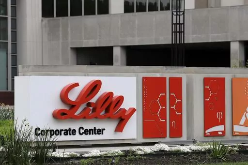 A sign for Eli Lilly & Co. sits outside their corporate headquarters in Indianapolis on April 26, 2017. The company said Wednesday, May 3, 2023, that its experimental Alzheimer’s drug appeared to slow worsening of the mind-robbing disease in a large study. (AP Photo/Darron Cummings, File)